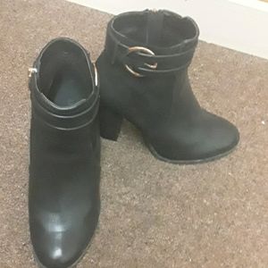 Black heeled leather boots